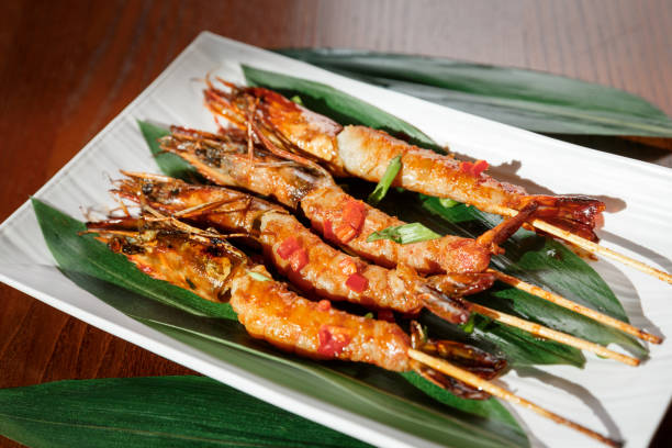 istock Fried hot big size shrimps  on sticks 915297802