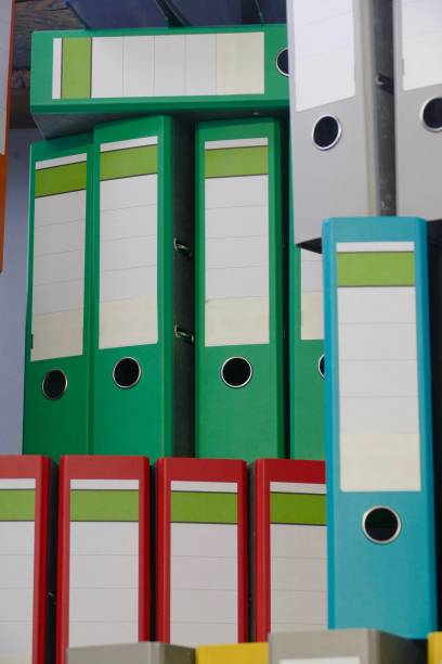 istock Colorful ring binders standing on the wooden staircase 915297832