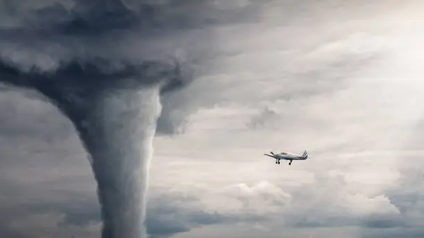 Tornado view - horizontal image with air plane near tornado. Nature power concept. Climate change. Weather illustration. Adventure travel conceptual photography.