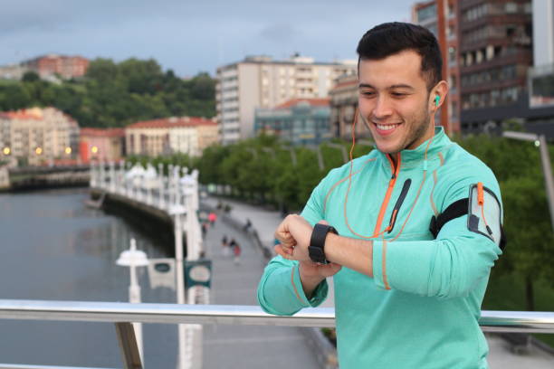 istock Healthy jogger using his fancy smartwatch 915300506