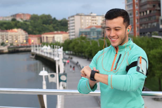 istock Ethic male using smartwatch to communicate 915300554