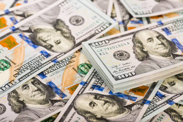 istock Background with money american hundred dollar bills 915303726