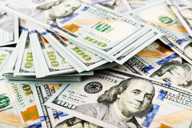 istock Background with money american hundred dollar bills 915303780