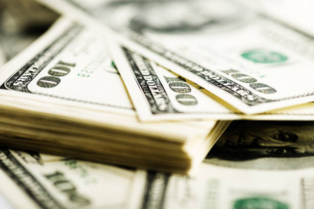 istock Stack of one hundred dollar bills close-up. 915303894