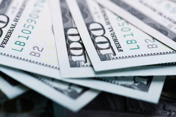 istock new one Hundred Dollar Bills (shallow DOF) 915304068