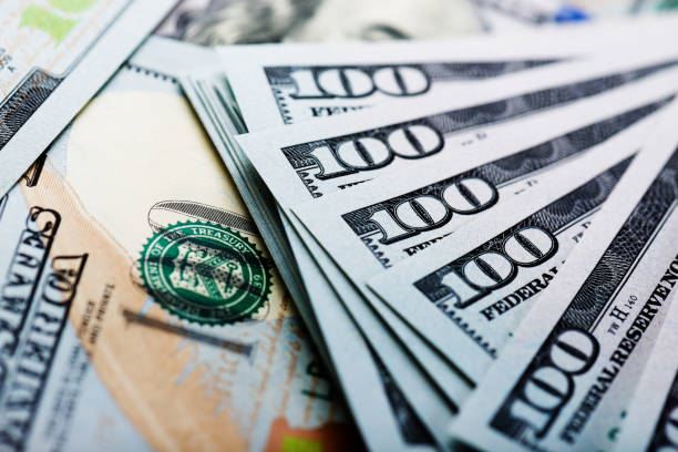 istock new one Hundred Dollar Bills (shallow DOF) 915304082