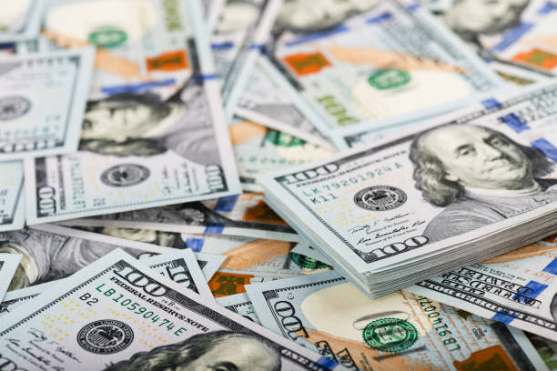 istock new one Hundred Dollar Bills (shallow DOF) 915304094