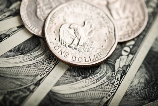 istock American banknotes and coins 915304148