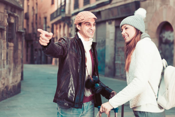 istock Tourists looking at historical object 915304760