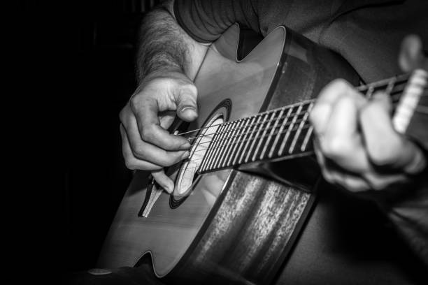 istock Man playing acoustic guitar 915315356
