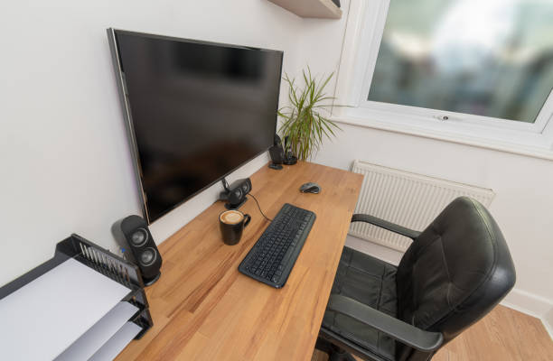 istock Mug of coffee on a desk with computer equipment 915315986