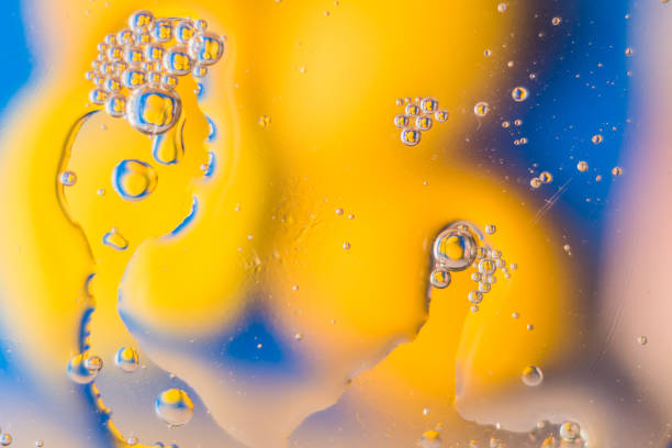 istock Oil on water - abstract macro background. 915318844
