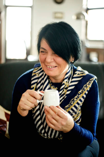 istock Breautiful mature woman with a cup 915319236