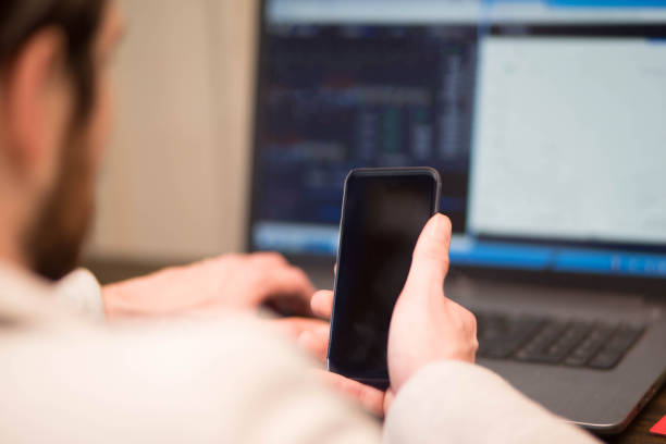 istock Busy businessman checking his stocks 915320912