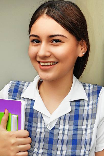 istock Cute Girl Student Smiling 915324078