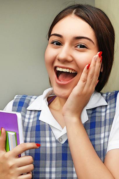 istock Excited Girl Student 915324200
