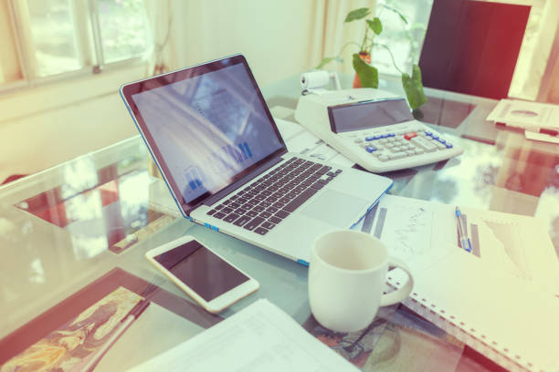 istock Open laptop and accessories with coffee cup for home 915324390