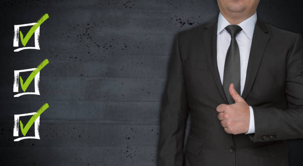 istock Checklists concept and businessman with thumbs up 915324464