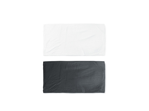 Blank black and white folded soft beach towel mockup. Clear wrapped wiper mock up laying on the floor. Shaggy fur bath textured jack-towel top view. Domestic cloth kitchen overlay template