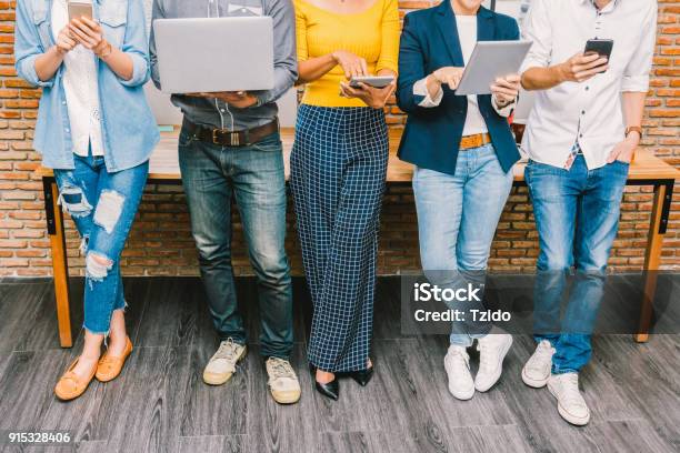Group Of Asian And Multiethnic Business People With Casual Suit Using The Technology Mobile Tablet Laptop And Computer For Working Or Social Network In Modern Officepeople Business Group Concept Stock Photo - Download Image Now