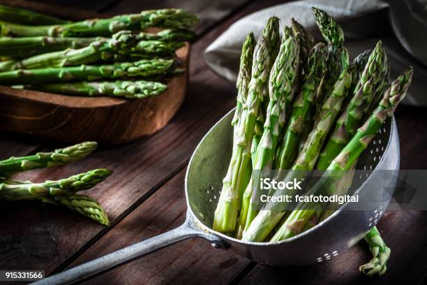 Fresh Asparagus In An Old Metal Colander Stock Photo - Download Image Now - Asparagus, Green Color, Vegetable
