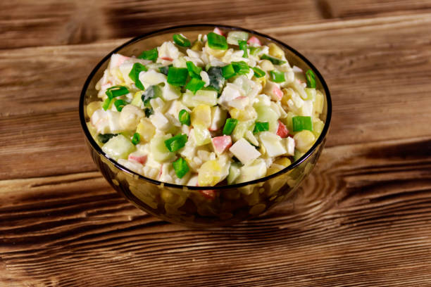 istock Salad with crab sticks, sweet corn, cucumber, eggs, rice and mayonnaise 915332262