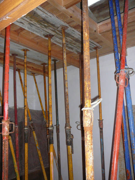 istock Extendable Steel poles supporting new concrete roof 915335552