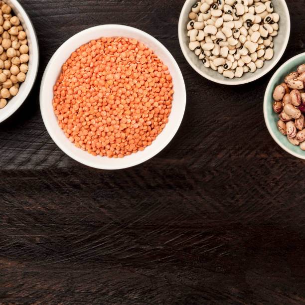 istock Legumes on dark background, from above with copy space 915335580