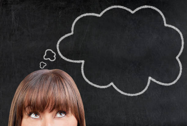 istock Brunette beautiful woman thinking blackboard chalkboard blank bubble comic 915338914