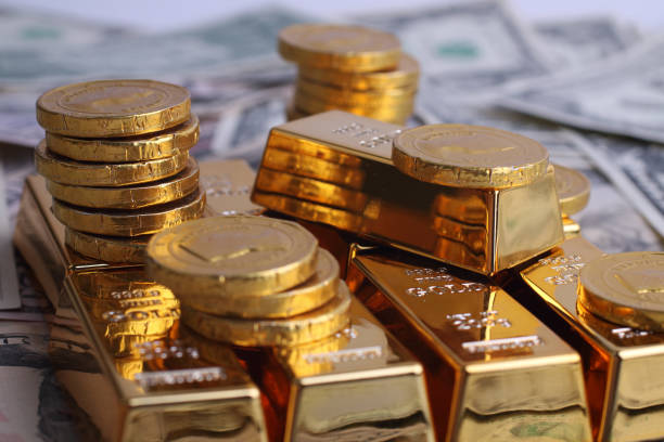 istock Gold coins with gold ingot 915340016