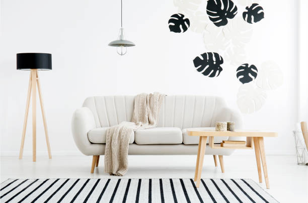 istock Living room interior with leaves 915344194