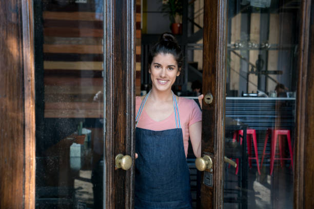 istock Beautiful business owner opening her restaurant looking at camera smiling 915352914