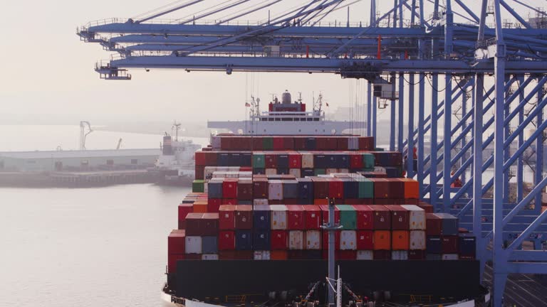 Cranes Unloading Cargo Ship - Drone Shot