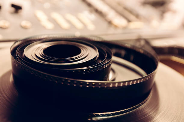 Vintage cine reel in a close-up shot. Vintage cine reel in a close-up shot. Cinematographic industry. spool photos stock pictures, royalty-free photos & images