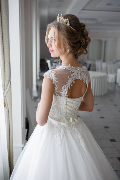istock A beautiful bride in wedding dress interior 915356842