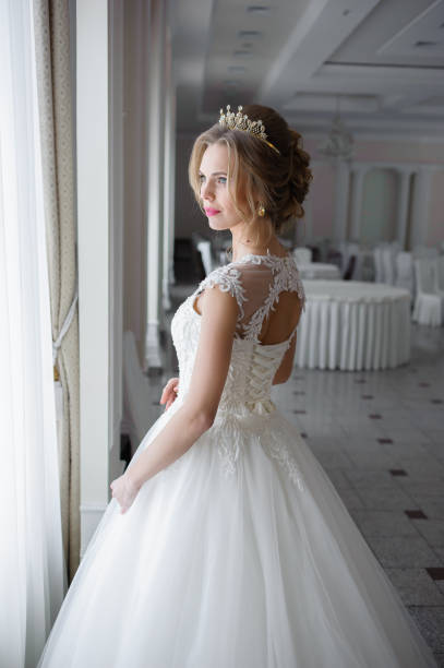 istock A beautiful bride in wedding dress interior 915356986