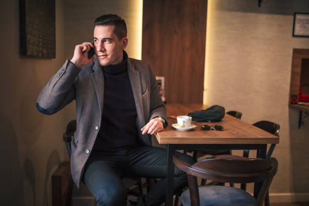 istock Smiling businessman talking on the phone 915357190