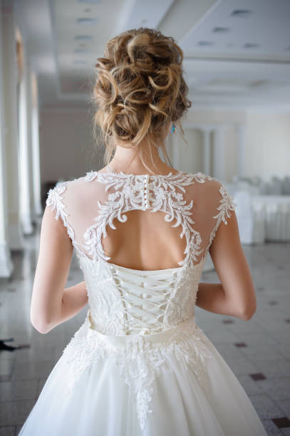 istock A beautiful bride in wedding dress interior 915357720