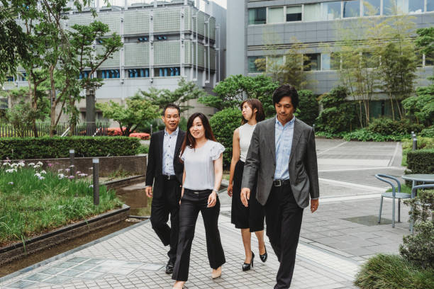 istock Japanese team walking together 915357996