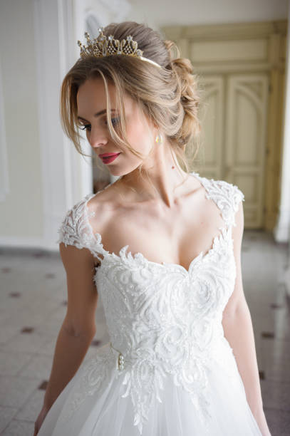 istock A beautiful bride in wedding dress interior 915358176