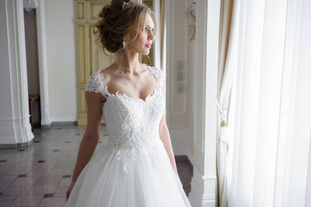 istock A beautiful bride in wedding dress interior 915358252