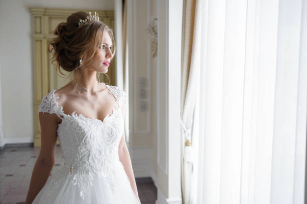 istock A beautiful bride in wedding dress interior 915358256