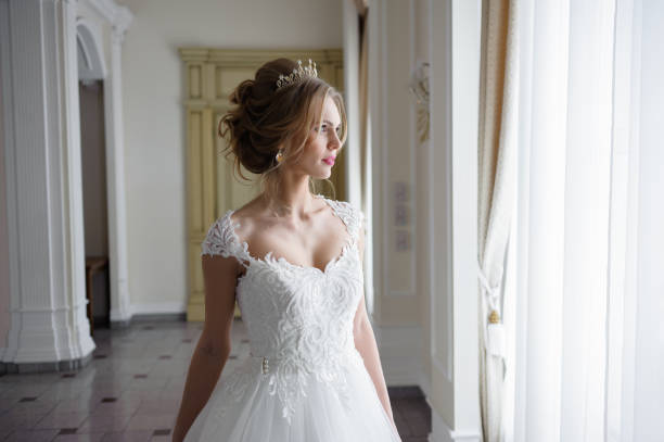 istock A beautiful bride in wedding dress interior 915358272