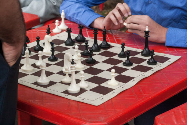 istock A chess game between a young student and a teacher 915362744