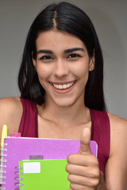 istock Latina Female Student With Thumbs Up 915365644