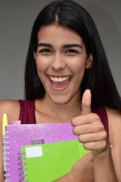 istock Female Student With Thumbs Up 915365780