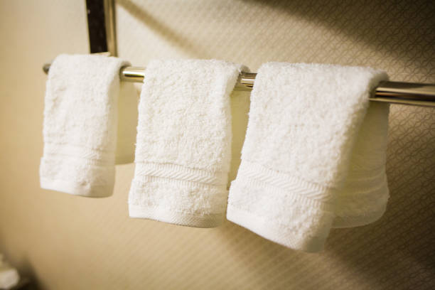 istock three Hanging white towels in the bathroom 915366338
