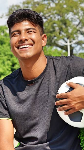 istock Latino Male Soccer Player Laughing 915366934