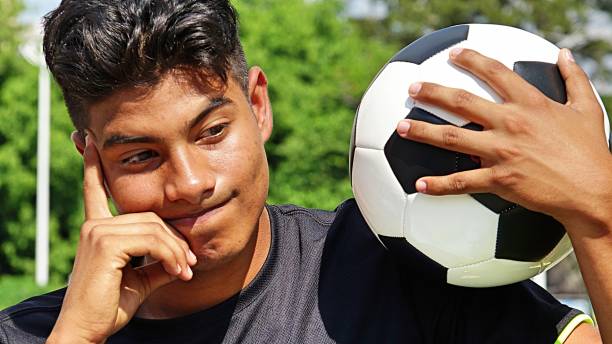 Athletic Male Soccer Player And Confusion