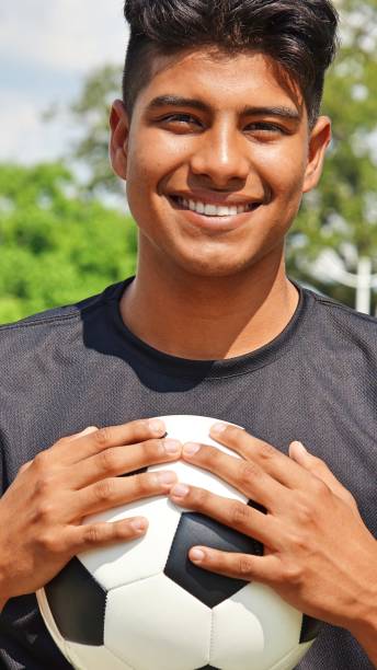istock Young Male Soccer Player Smiling 915371412